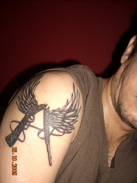 Abhishek - Winged rifle A: real inked placement tattoo photo thumbnail