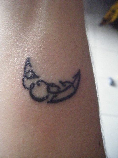 Adriana - E+A moon slice: real inked placement tattoo photo thumbnail