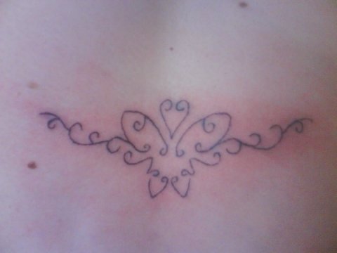 Yvonne - Butterfly lowerback: real inked placement tattoo photo thumbnail